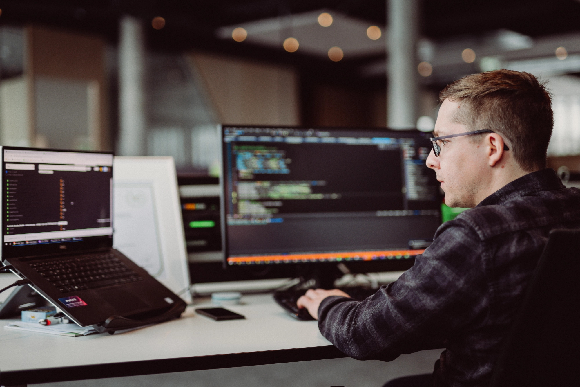 Two people working side by side